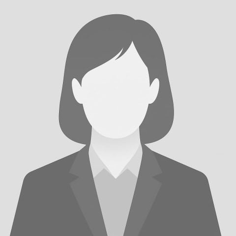 Silhouette of a businesswoman with shoulder-length hair, wearing a blazer, on a gray background.